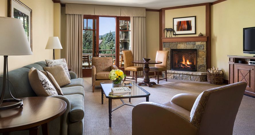 Spacious living areas with stone fireplaces to cosy up around. Photo: Four Seasons Vail - image_7